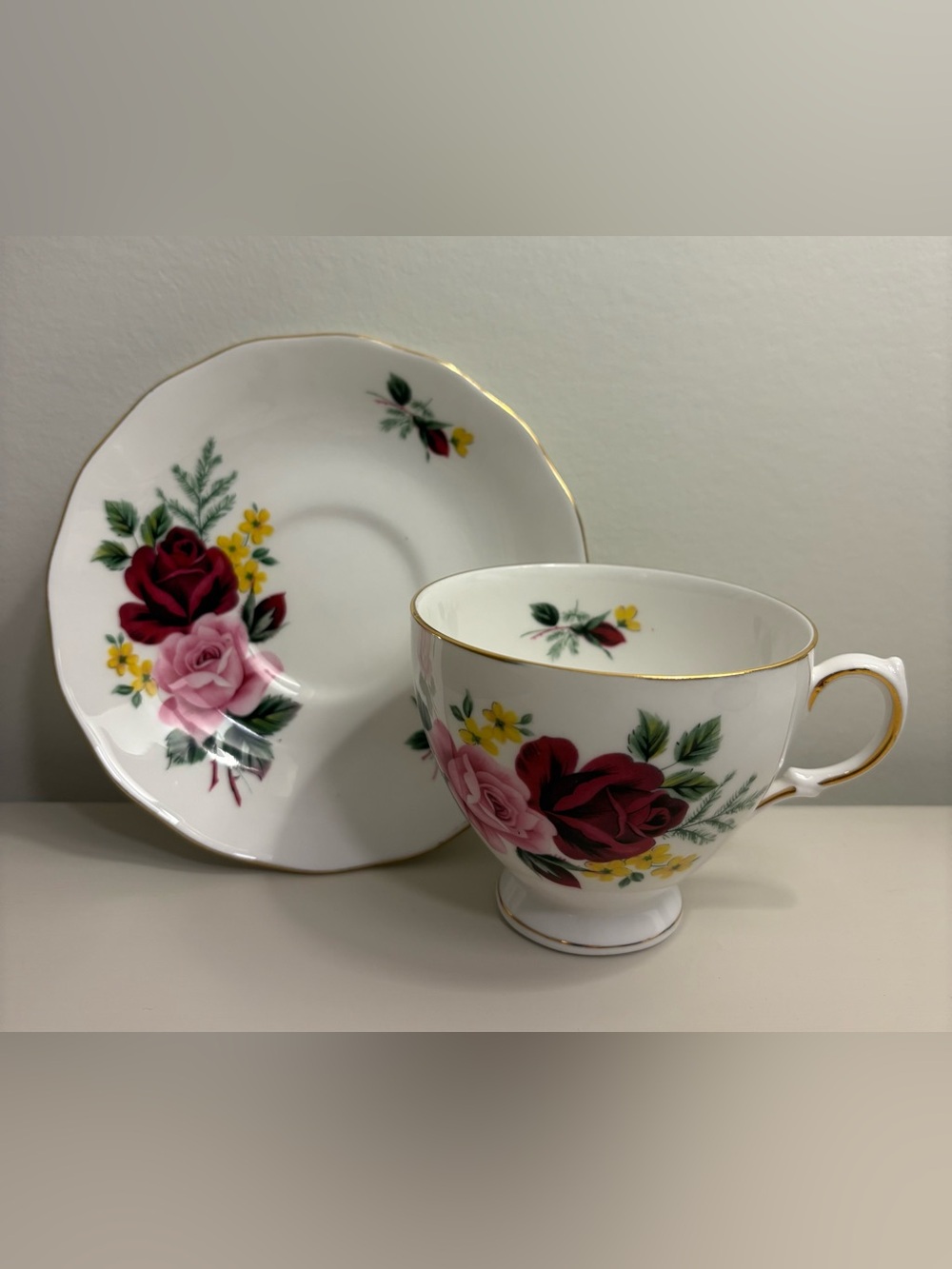 Queen Anne Porcelain Teacup and Saucer with Pink and Red Rose Pattern